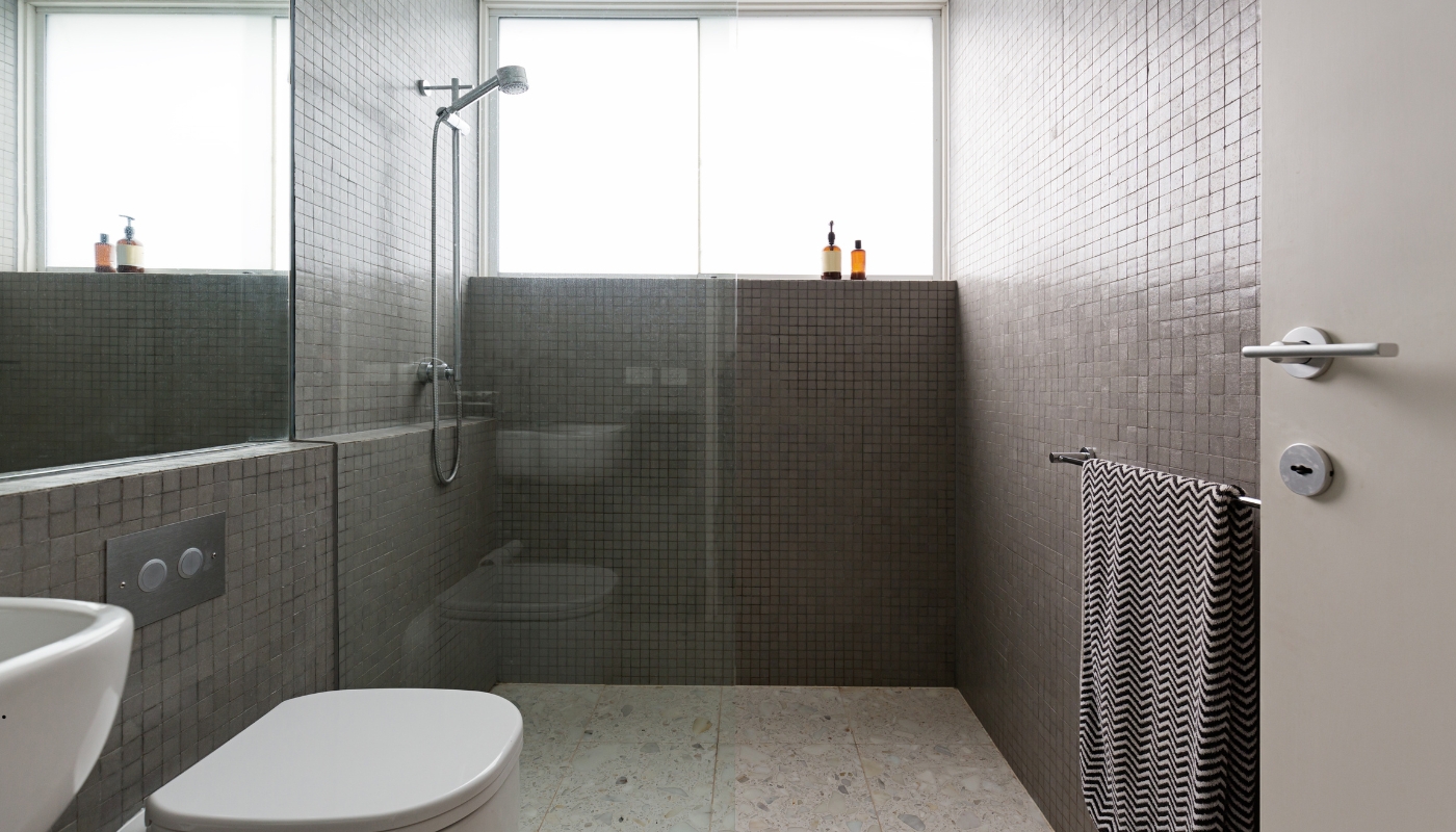 Classic bathroom remodel in Roseville, CA with elegant fixtures, custom cabinets, and modern design by Remodel California.
