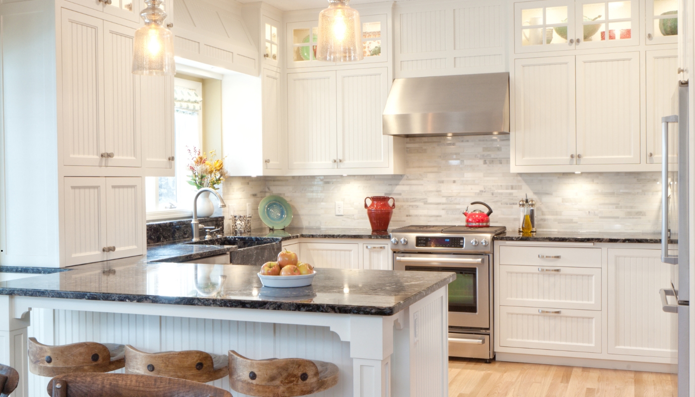 Elegant classic kitchen remodel in Davis CA with custom cabinetry, stone countertops, and timeless design by Remodel California.