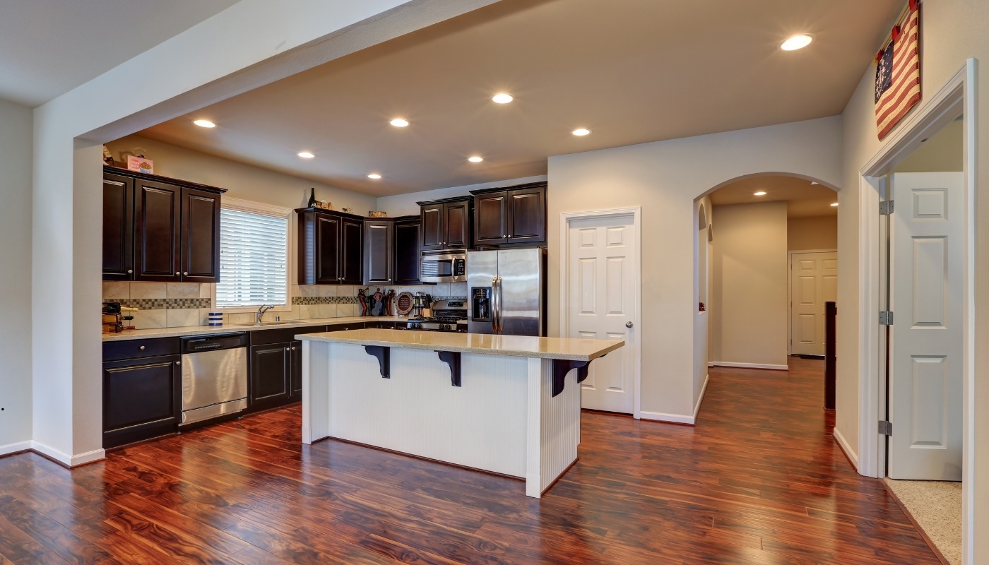 Elegant classic kitchen remodel in Citrus Heights, CA, showcasing timeless design with white cabinets, marble countertops, and modern lighting.