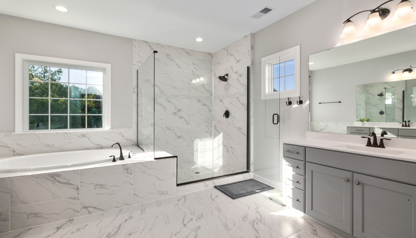 Classic bathroom remodel in Folsom CA with marble surfaces and elegant lighting