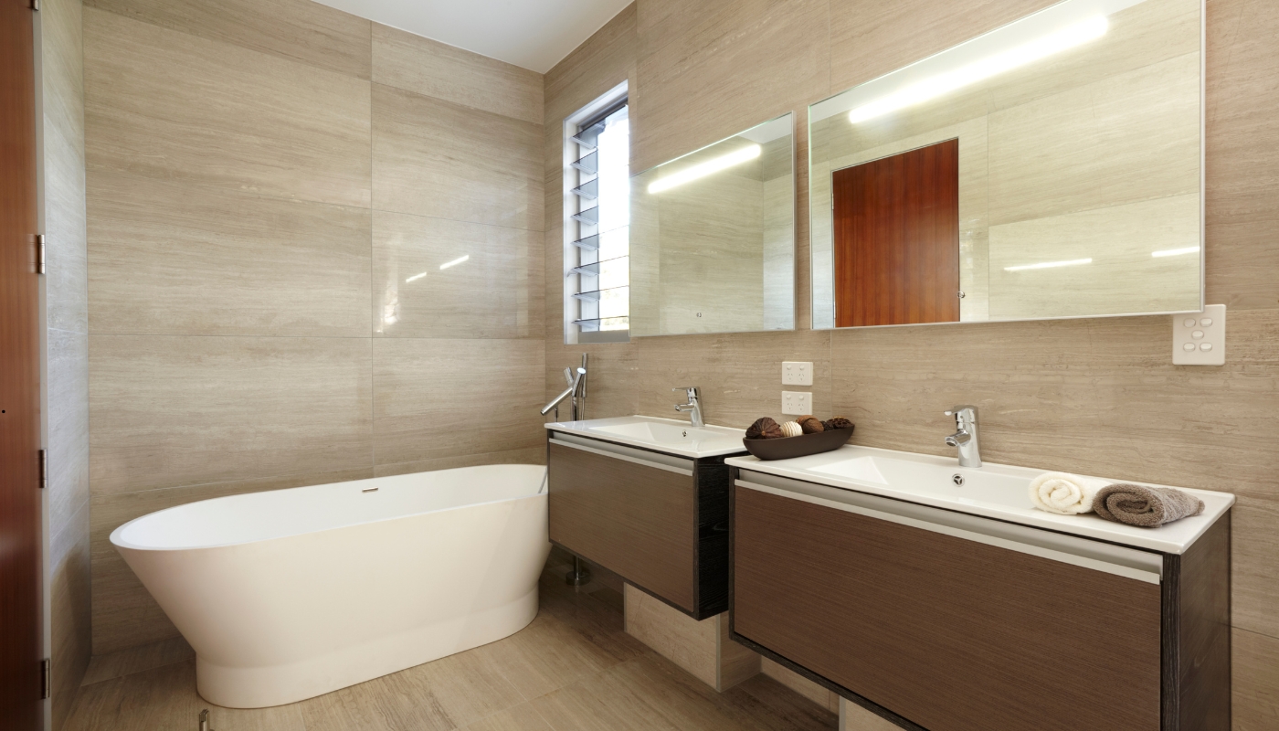 Elegant classic bathroom remodel in Roseville, CA featuring marble countertops, freestanding bathtub, and timeless design by Remodel California.