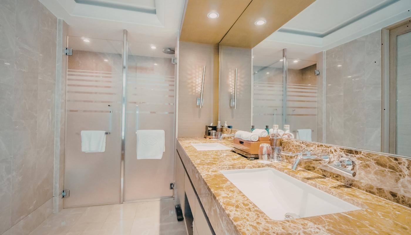 Minimalist walk-in shower with large format tile and modern fixtures
