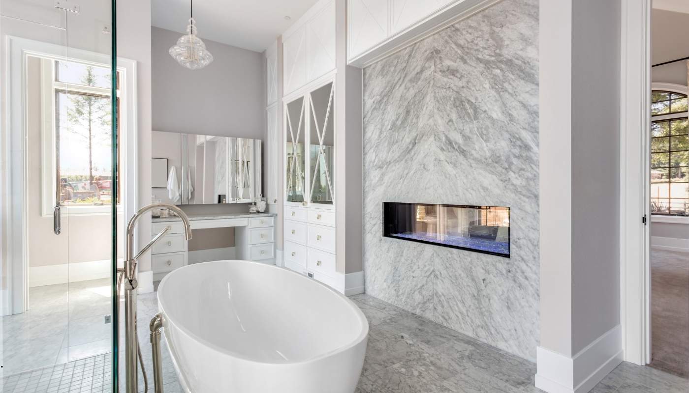 Modern luxury bathroom renovation in Folsom, California with custom shower, freestanding tub, and high-end fixtures