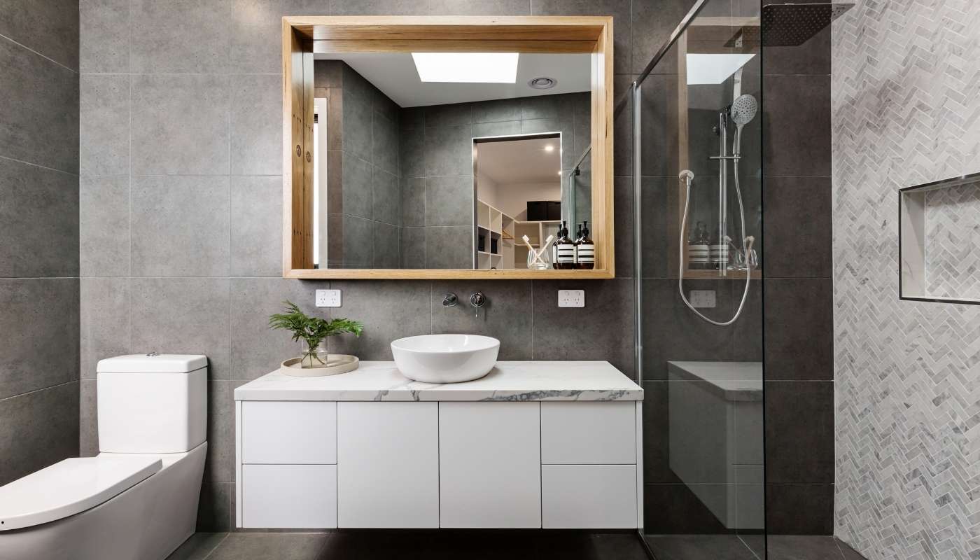 Elegant luxury bathroom renovation in Davis, California by Remodel California featuring custom cabinetry, marble countertops, and modern fixtures.